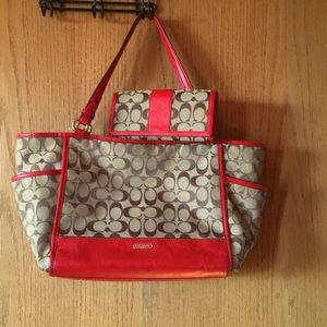 Signature Coach handbag and matching billfold.